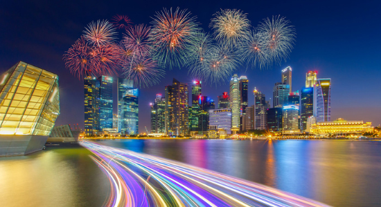 Stock Landscape photo of the Singapore financial district and business buildings in the background. Colourful streaks representing speed of lighting also included.